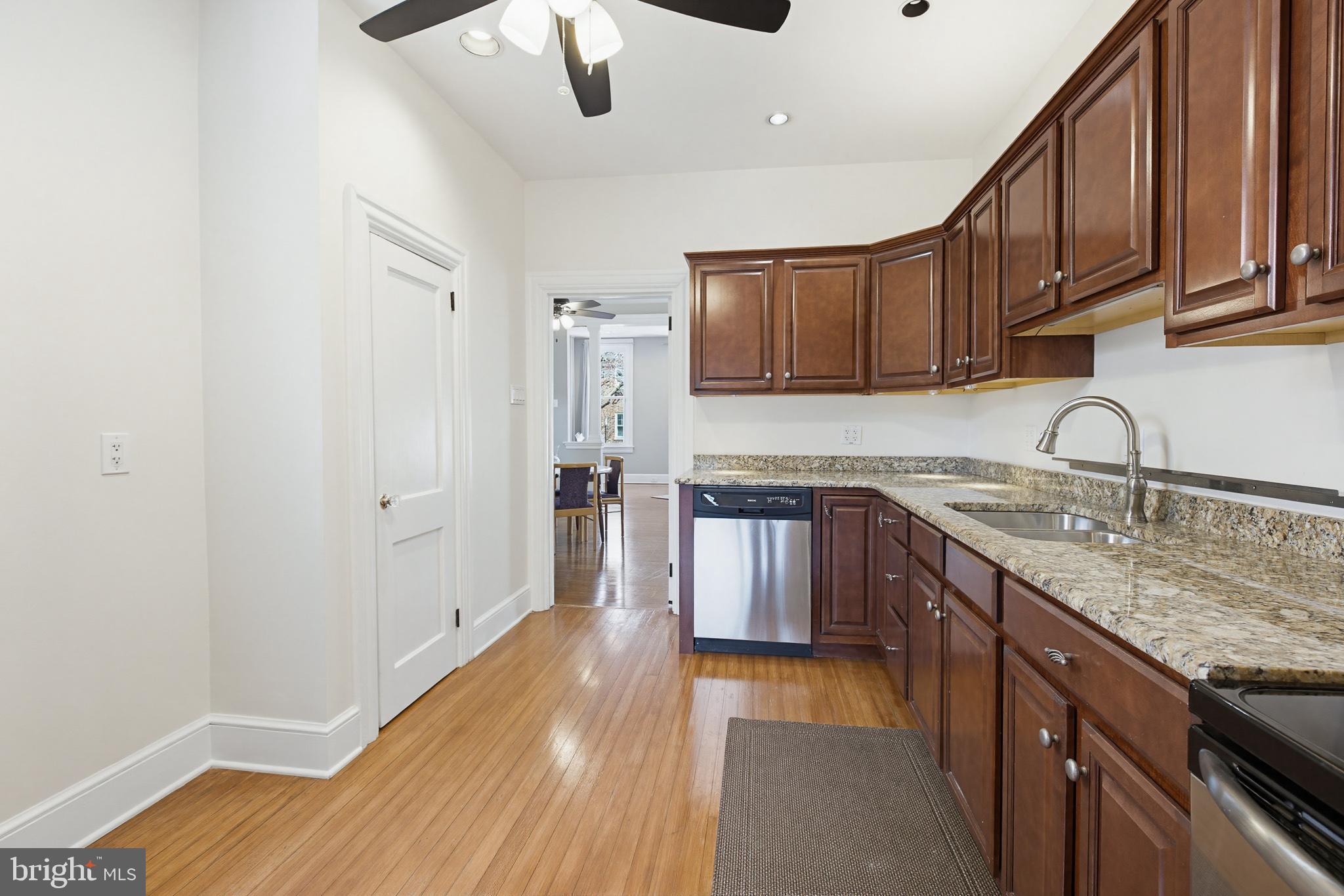 114 North Charlotte Street Lancaster, PA 17603 - Photo 13 of 40 a kitchen with stainless steel appliances granite countertop a sink stove and refrigerator