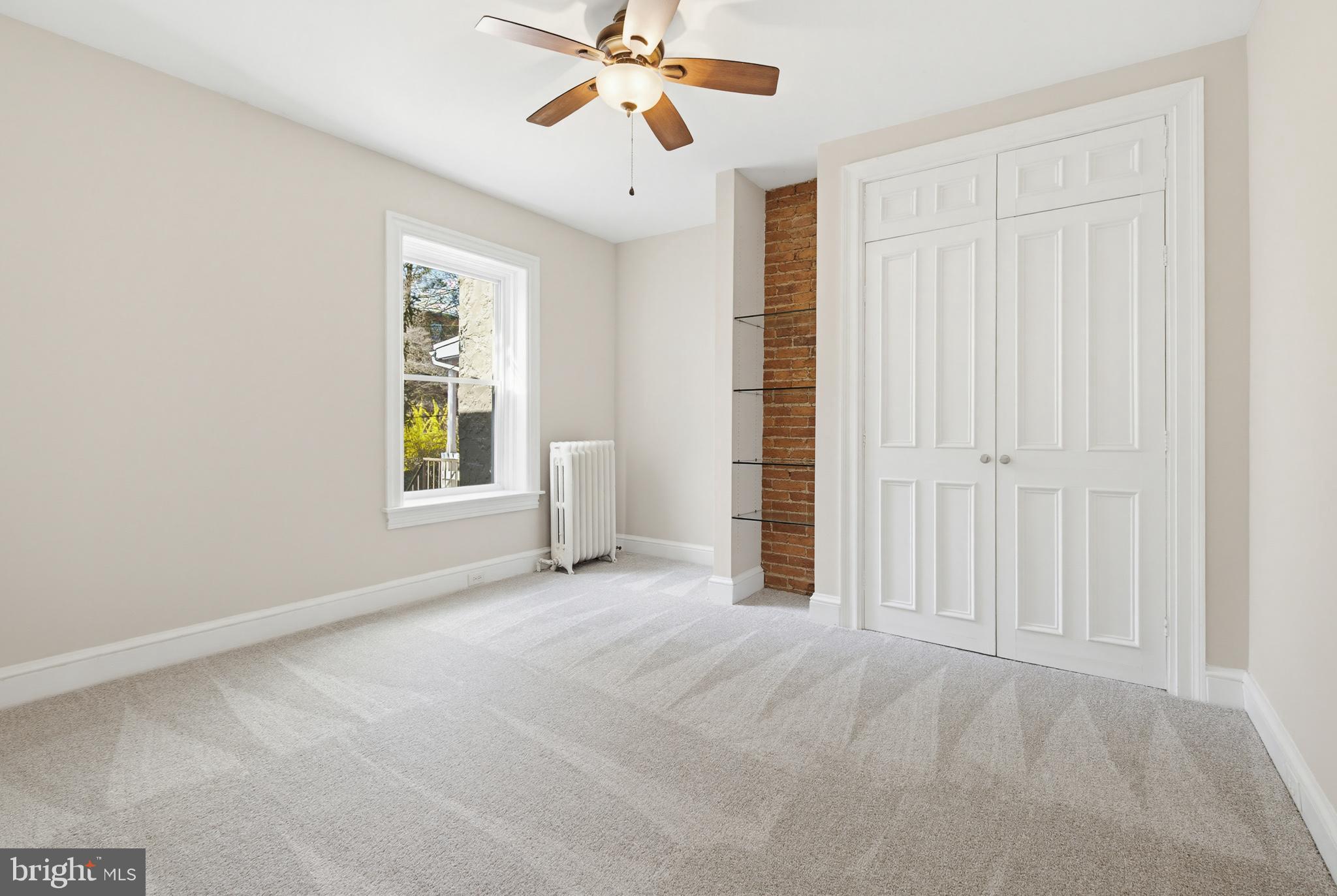 114 North Charlotte Street Lancaster, PA 17603 - Photo 22 of 40 an empty room with windows and fan