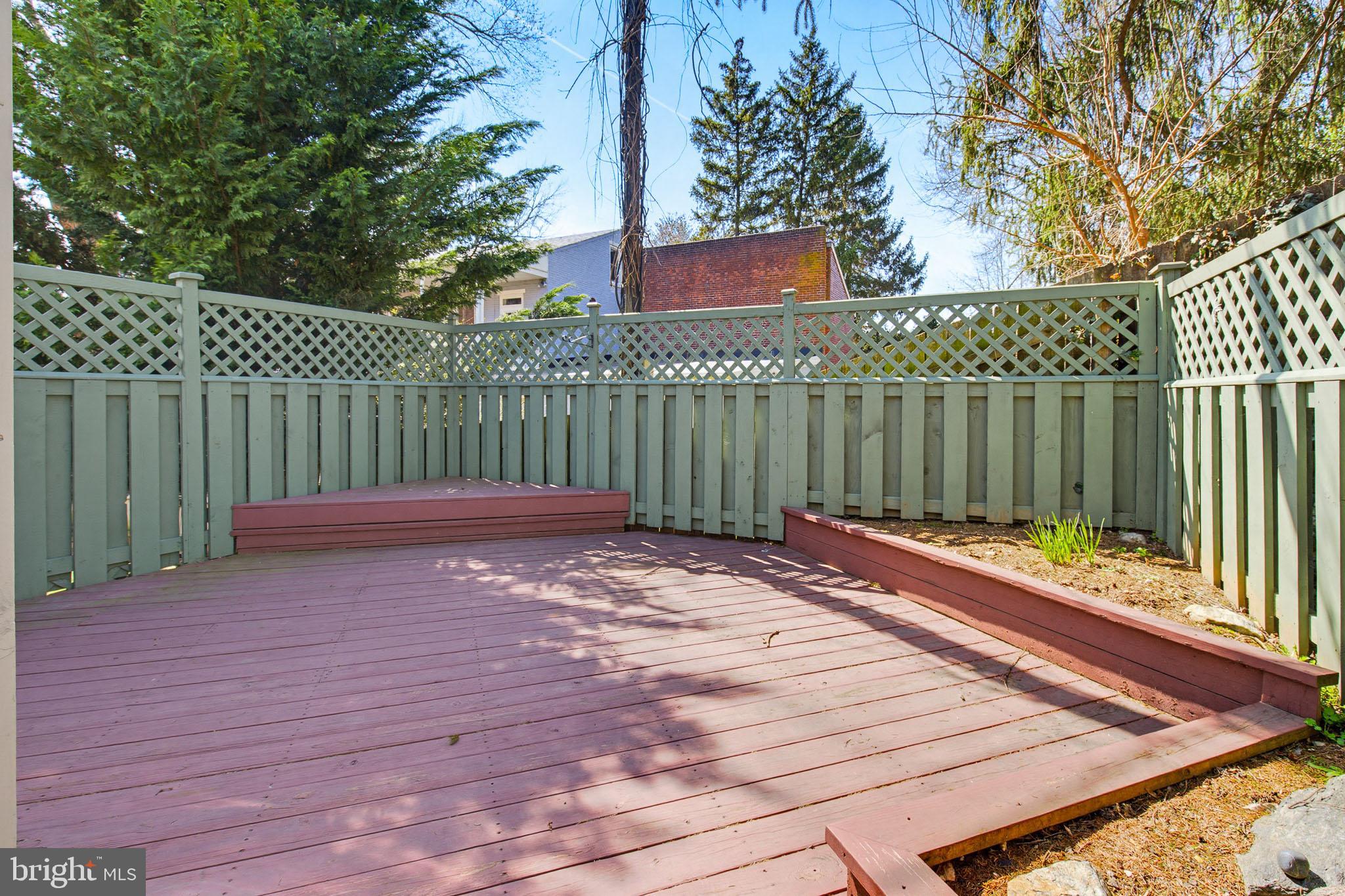114 North Charlotte Street Lancaster, PA 17603 - Photo 38 of 40 a view of a backyard with wooden fence and trees