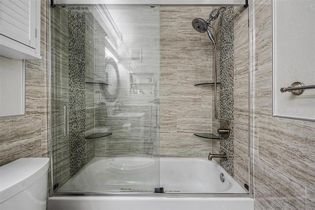 1550 South Belcher Road, Unit 525 Clearwater, FL 33764 - Photo 21 of 28 a bathroom with a shower