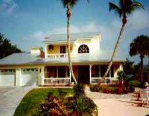 112 South Sewalls Point Road Stuart, FL 34996 - Photo 1 of 1 a view of a white house with a large window and potted plants