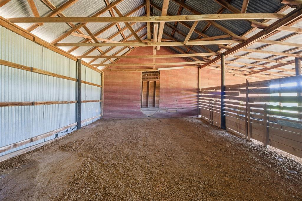 958 Cedar Mills Road Gordonville, TX 76245 - Photo 36 of 40 a view of a room with racks on the wall