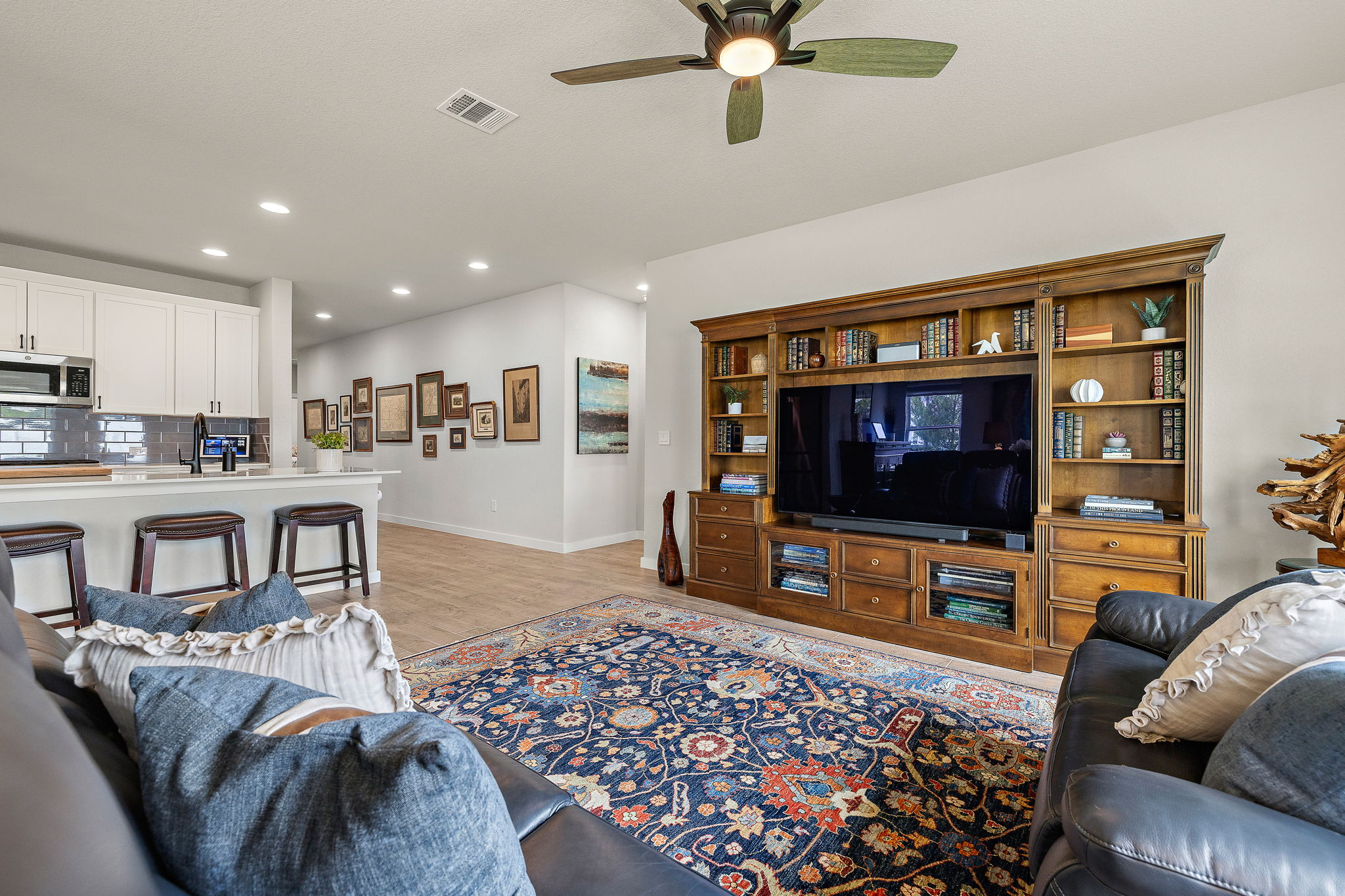 234 Appleberry Lane Elgin, TX 78621 - Photo 17 of 28 The open layout keeps everyone connected, whether you’re cooking, gathering at the island, or settling in for movie night.