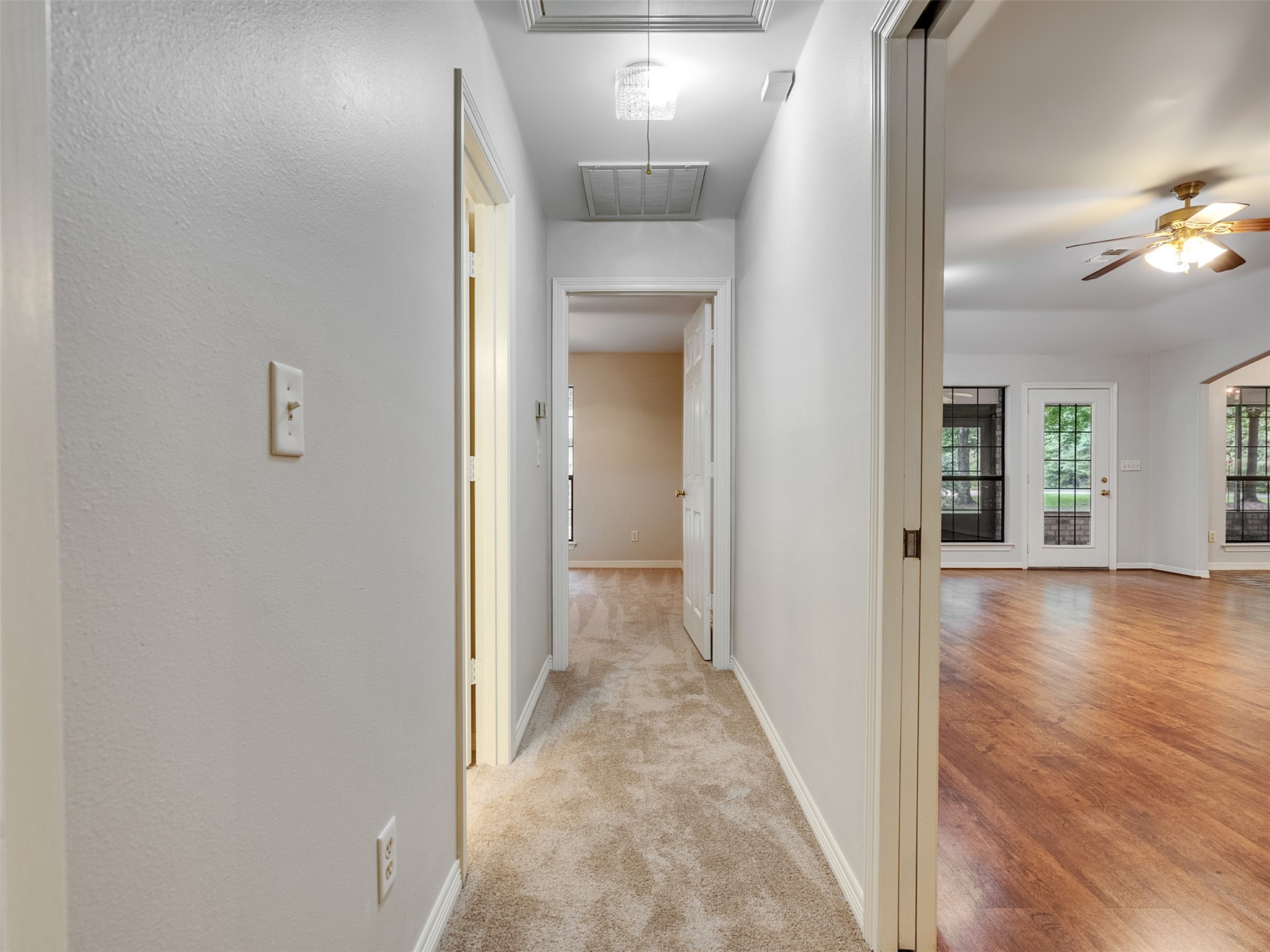 195 Coral Gables Trinity, TX 75862 - Photo 31 of 50 view of a hallway with wooden floor and a living room