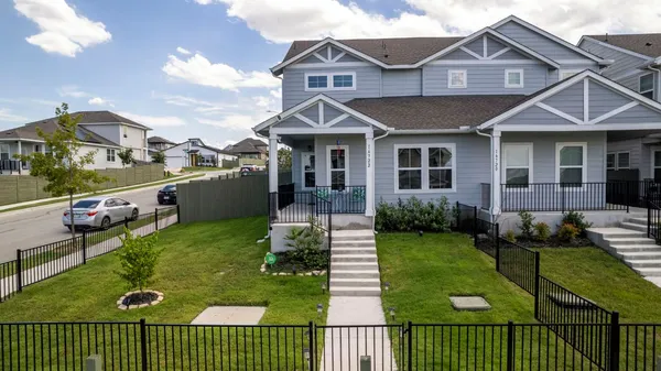 a view of a house with a garden and deck