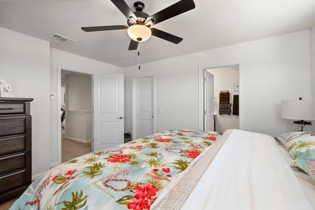 a kitchen with a refrigerator and a plant