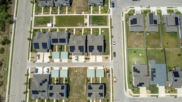 a view of a patio with couches table and chairs with garden view