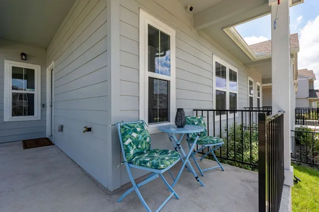 a view of a chair and table in the balcony