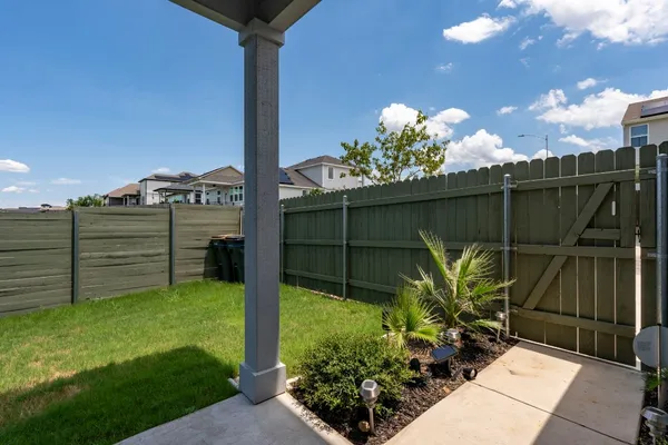 a view of a backyard with potted plants
