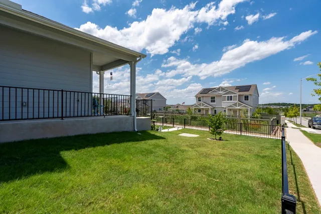 a view of swimming pool from a big yard