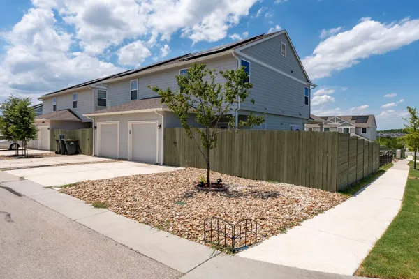 a house view with a backyard space