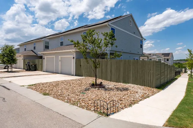 a house view with a backyard space