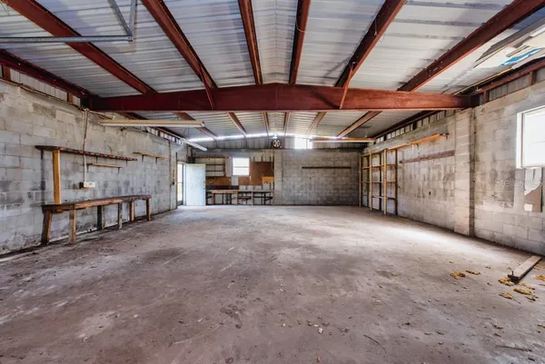 a view of empty room with wooden ceiling