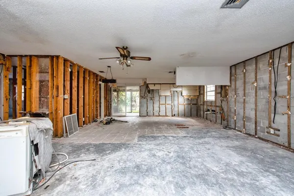 a view of an empty room with a fireplace