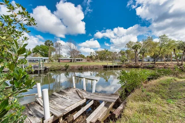 a view of a lake with sitting area