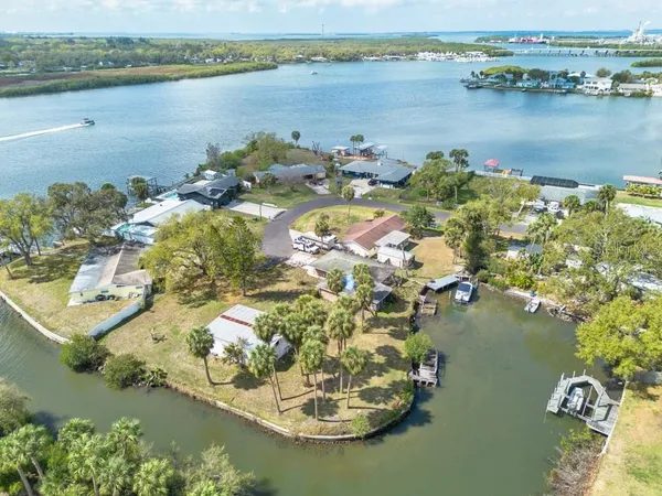 an aerial view of a house with a lake view