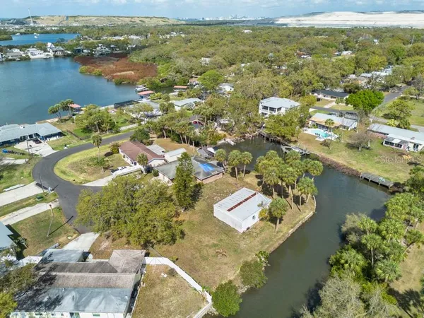an aerial view of residential houses with yard