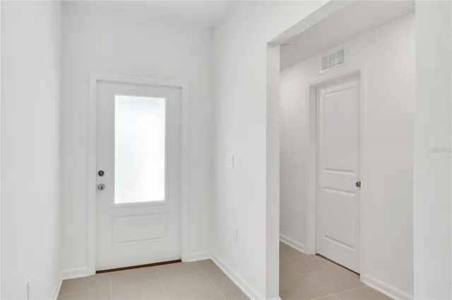 a view of an empty room and closet area