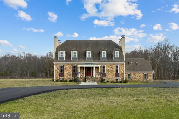 a outdoor view of a house with garage