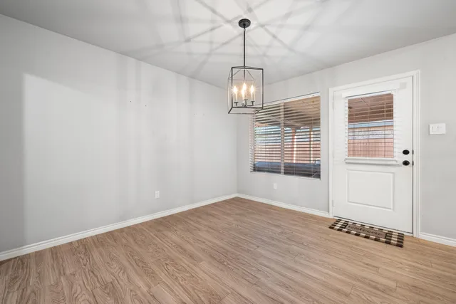 a bathroom with a double vanity sink a mirror and a bathtub