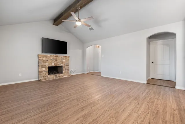 a kitchen with stainless steel appliances granite countertop a sink refrigerator and cabinets