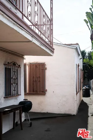 a view of a balcony with furniture
