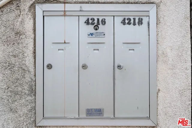 a view of a white house with many windows