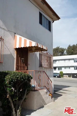 a view of a house with a street