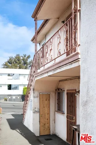 a view of a hallway with seating area