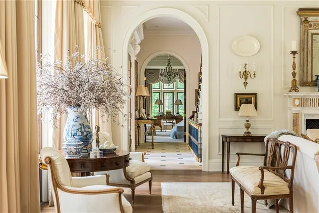 a view of a room with furniture and windows