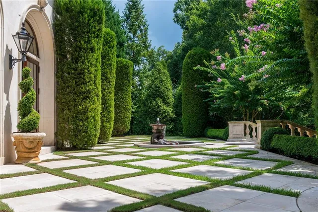 a front view of a house with swimming pool and glass door