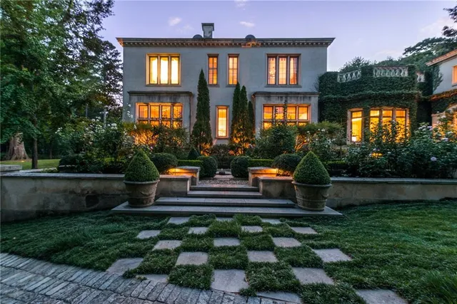 an aerial view of a house with a yard and garden