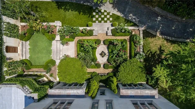 a view of a water fountain in the backyard