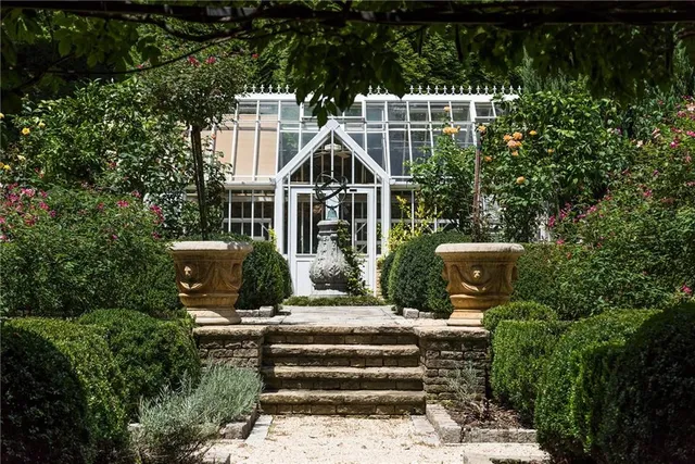 a view of a swimming pool with a yard