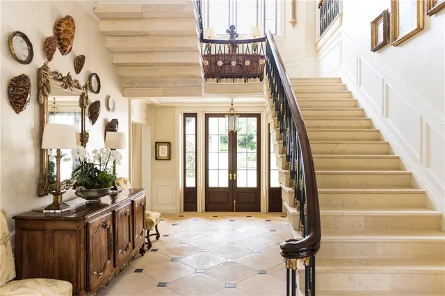 a view of entryway and hall with wooden floor