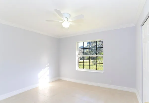 a view of an empty room with a window