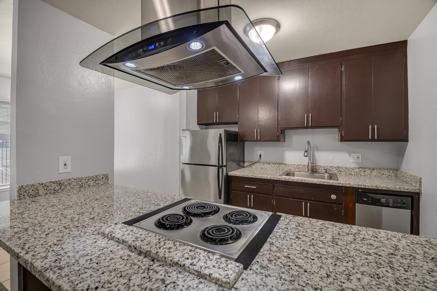 1626 Dwight Way Berkeley, CA 94703 - Photo 5 of 9 a kitchen with a stove a sink and cabinets