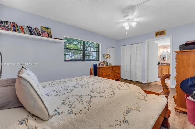 a bedroom with a bed furniture and a window