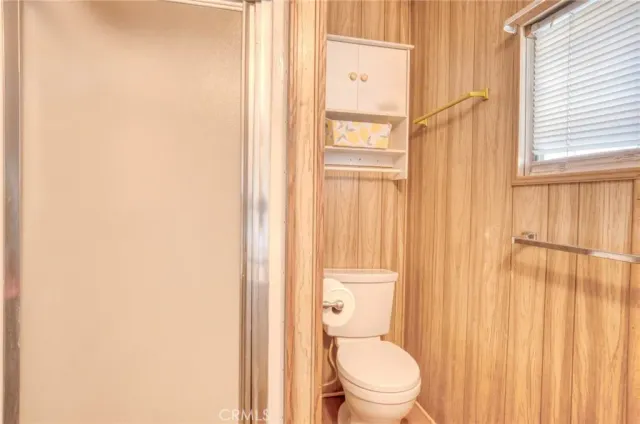 a white toilet sitting next to a bathroom sink