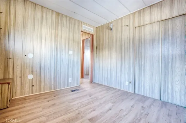 an empty room with wooden floor