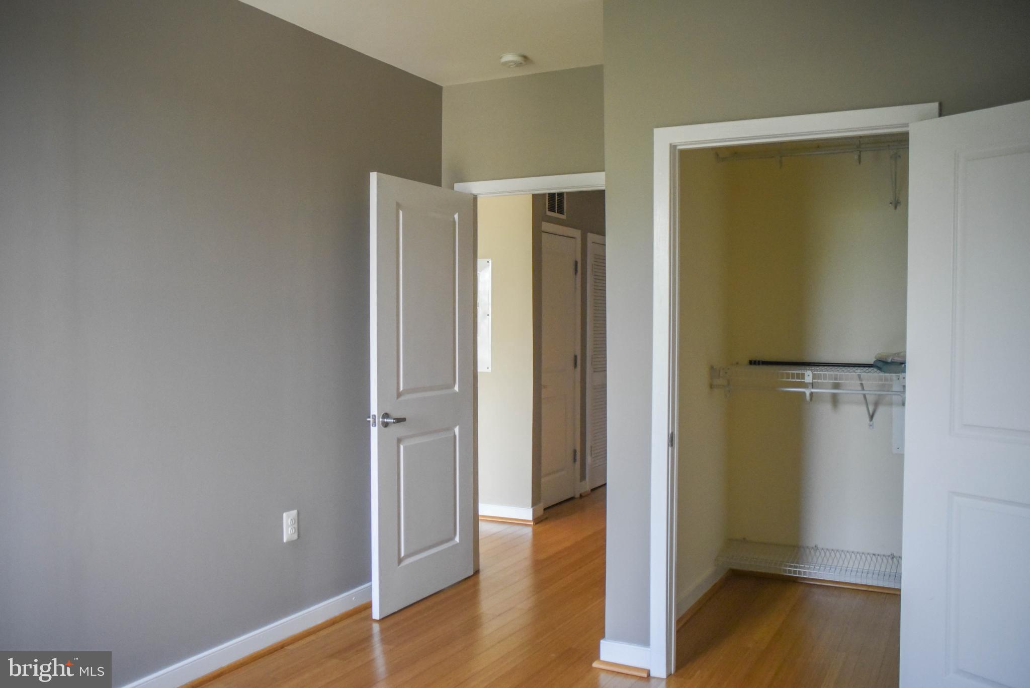 181 East Reed Avenue, Unit 313 Alexandria, VA 22305 - Photo 6 of 7 a view of a hallway with wooden floor
