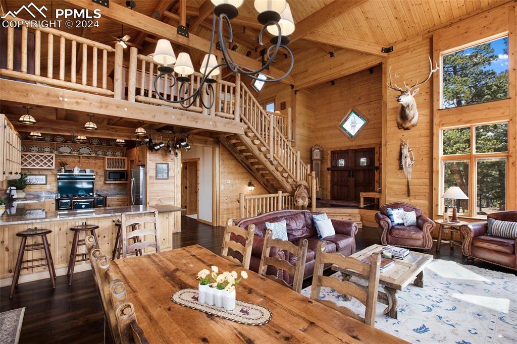 527 Cougar Point Divide, CO 80814 - Photo 12 of 50 a view of a dining room with furniture a chandelier and wooden floor