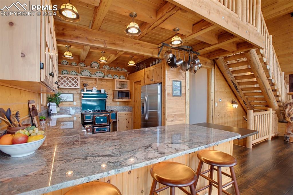 527 Cougar Point Divide, CO 80814 - Photo 14 of 50 a view of a dining room with furniture wooden floor and chandelier