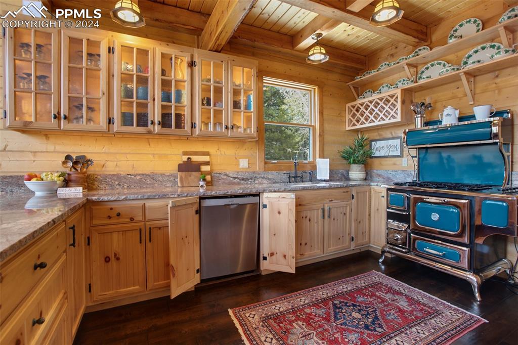527 Cougar Point Divide, CO 80814 - Photo 16 of 50 a kitchen with a sink stove and cabinets