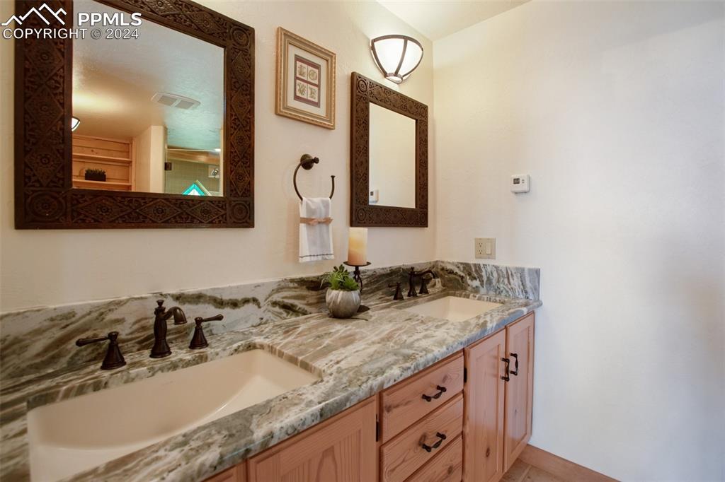527 Cougar Point Divide, CO 80814 - Photo 27 of 50 a bathroom with a sink and a mirror