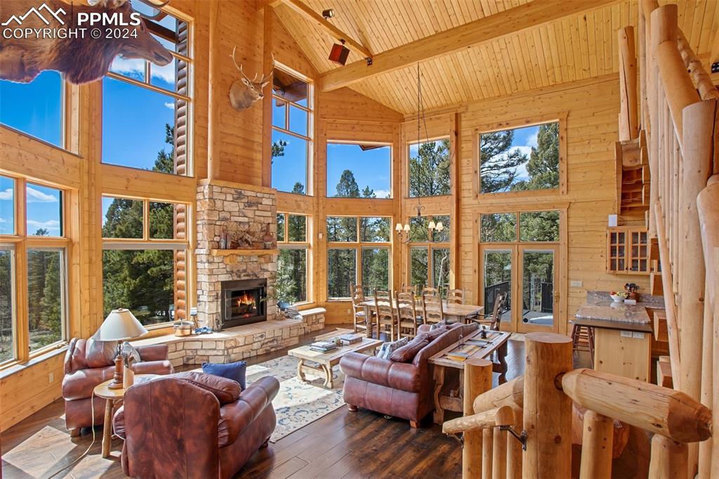 527 Cougar Point Divide, CO 80814 - Photo 7 of 50 a outdoor living space with patio furniture and a fireplace