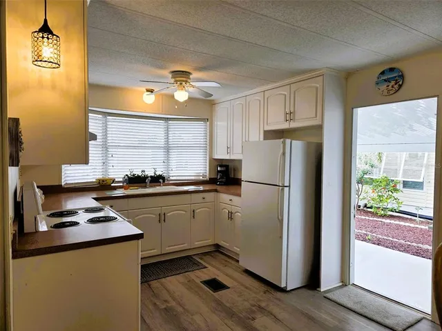 a view of a dining room with furniture and a wooden floor