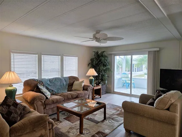 a workspace with wooden floor and windows