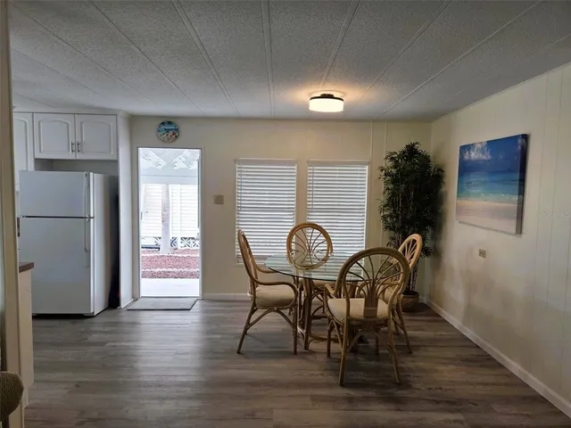 a bedroom with a bed and a lamp