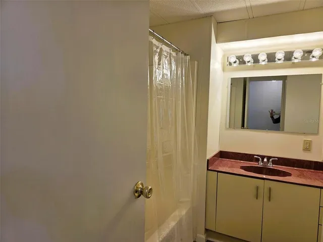 a view of a swimming pool with outdoor seating